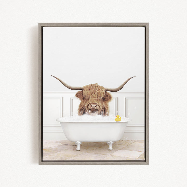 A horned animal, possibly a yak or a bison, is sitting in a white bathtub filled with water, with a rubber duck floating in the tub.