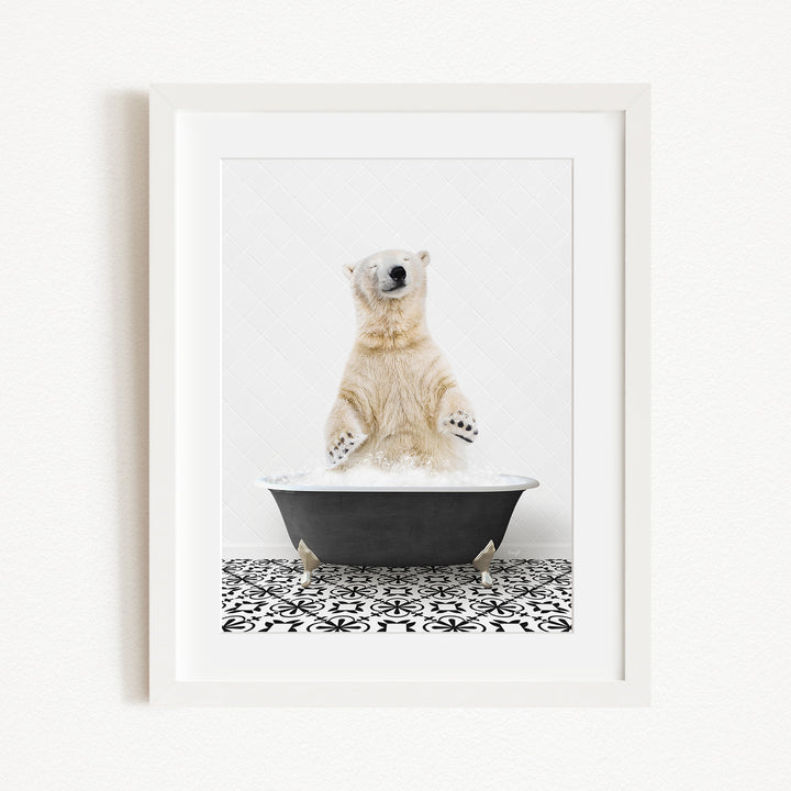 A polar bear standing in a bathtub filled with water, with its paws raised in the air.