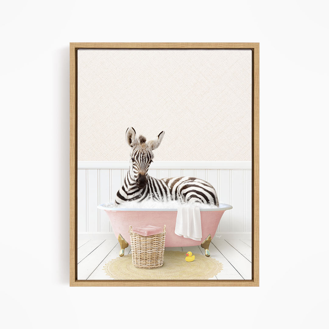 A zebra is sitting in a pink bathtub, surrounded by a basket of toys and a yellow rubber ducky, creating a whimsical and playful scene.