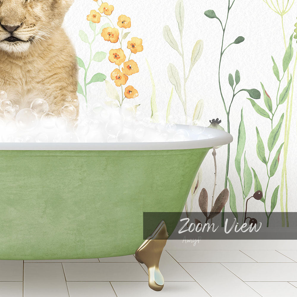 A cat is sitting in a green bathtub filled with bubbles, surrounded by a floral wallpaper.