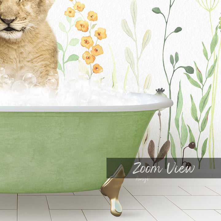 A cat is sitting in a green bathtub filled with bubbles, surrounded by a floral wallpaper.