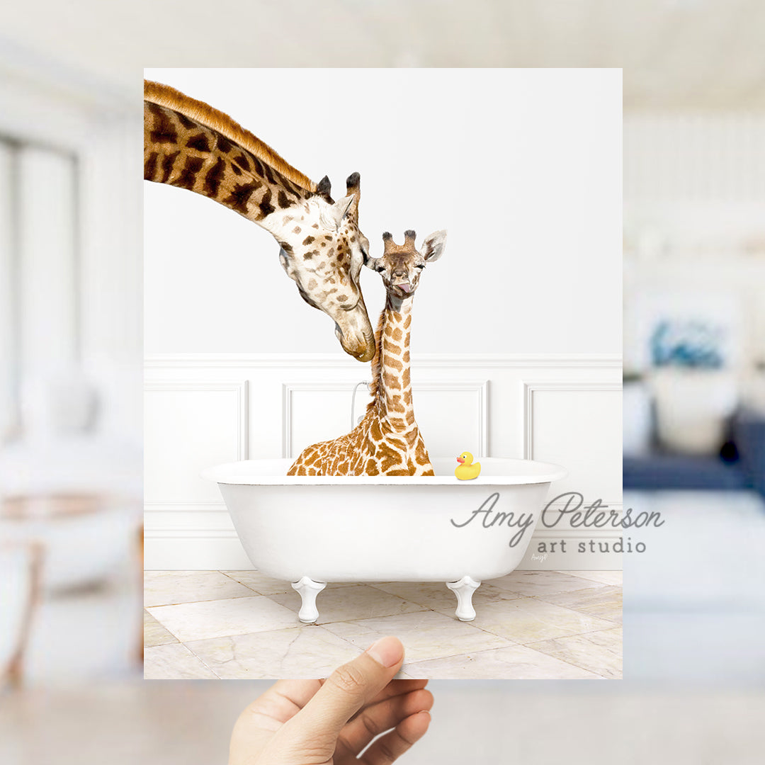 a hand holding up a card with two giraffes in a bathtub