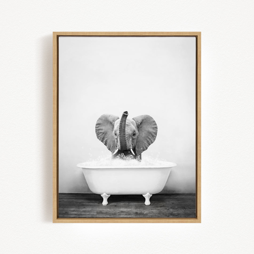 A baby elephant sitting in a white bathtub filled with water, creating a playful and whimsical scene.