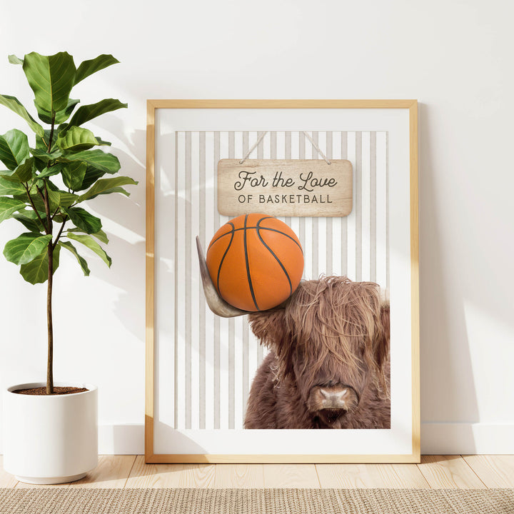 a framed poster with a basketball and a Highland cow, along with the text "For the Love of Basketball".