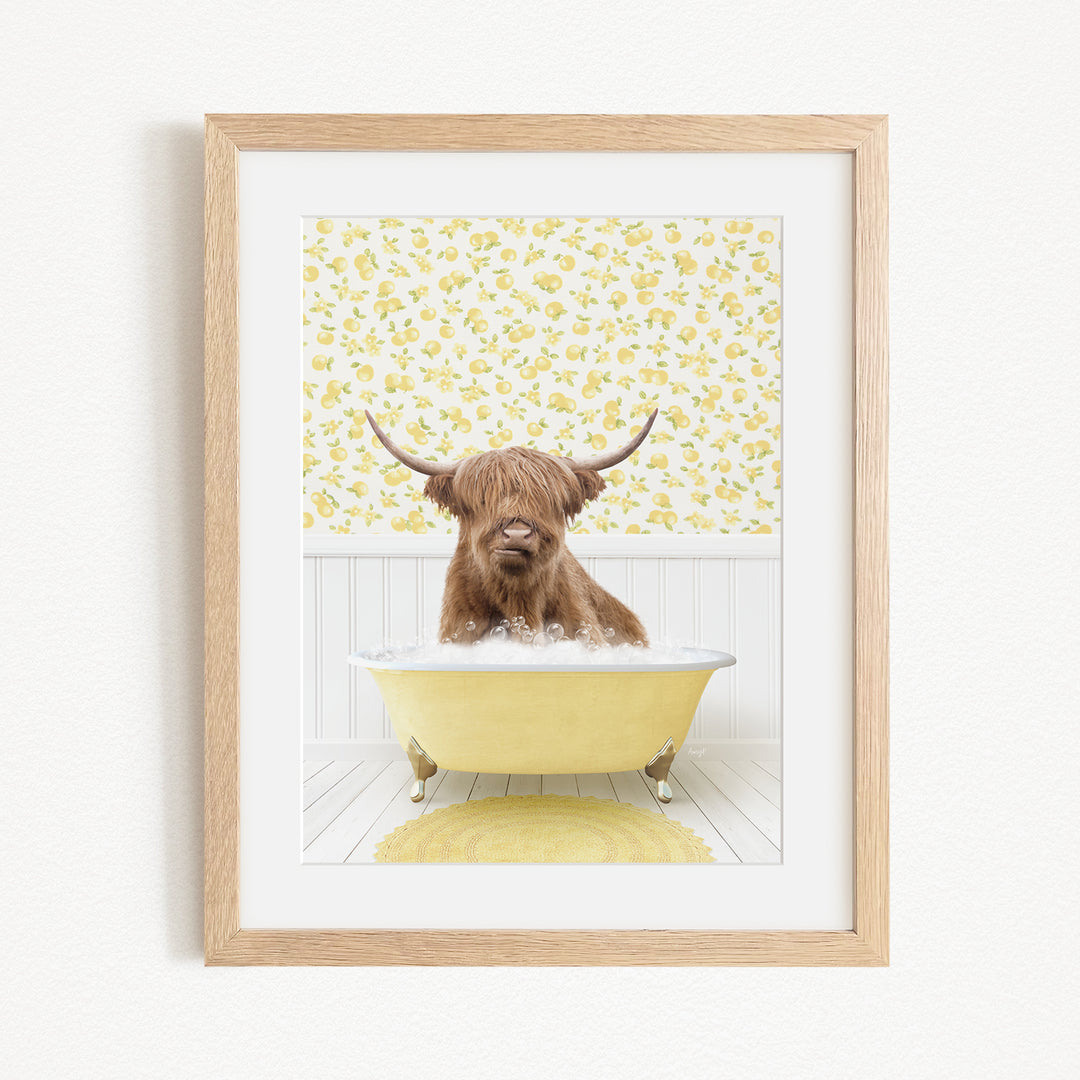A brown Highland cow with long horns is sitting in a yellow bathtub, surrounded by a yellow floral pattern on the wall behind it.