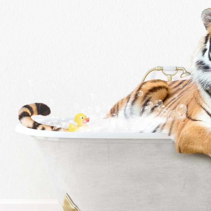 a stuffed tiger sitting in a bath tub