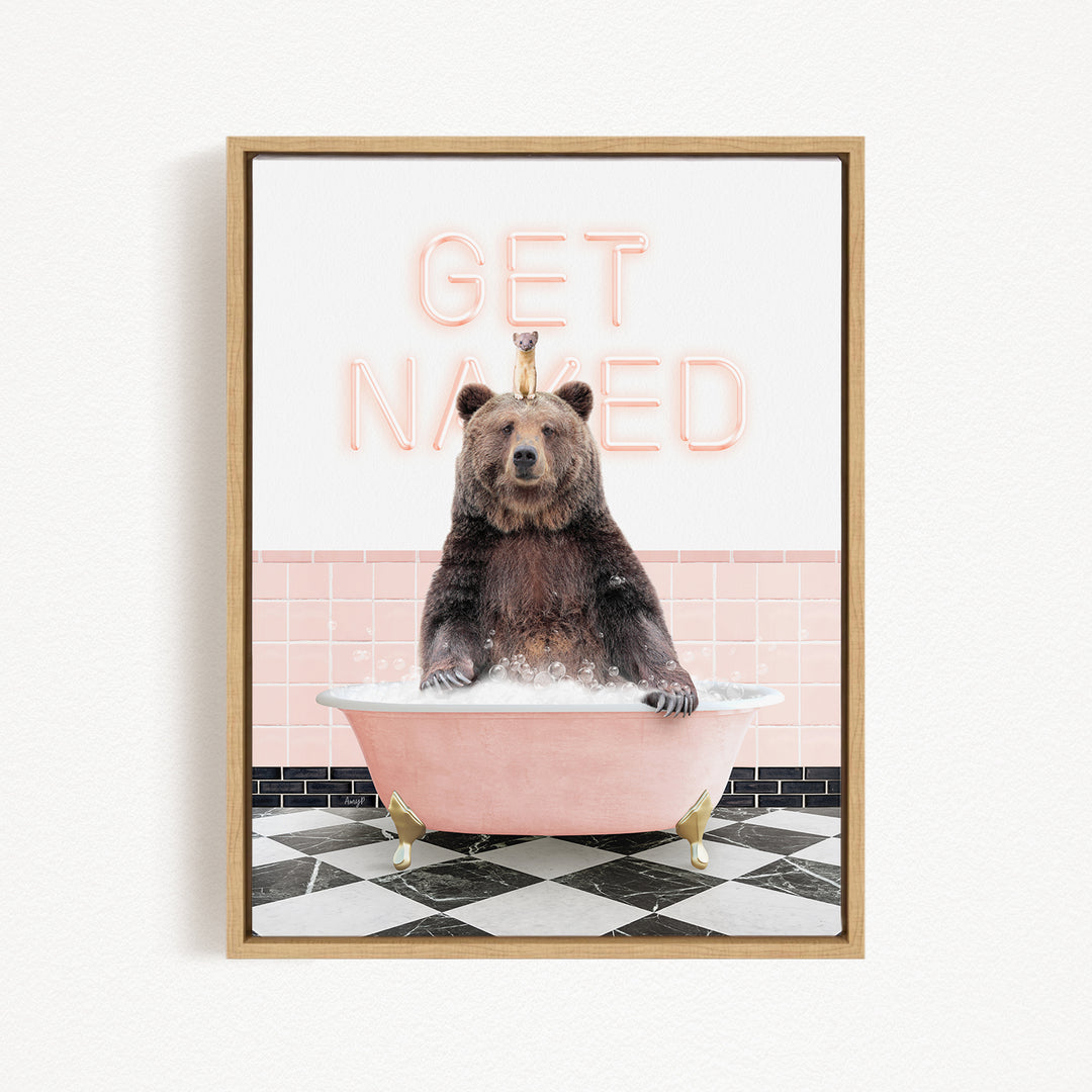 A brown bear sitting in a pink bathtub with the words "GET NAKED" written on the wall behind it.