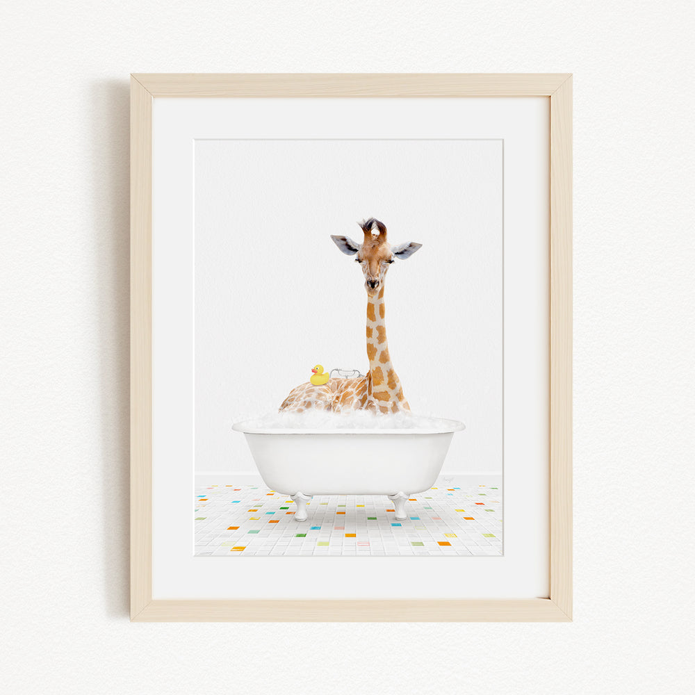 A giraffe is sitting in a white bathtub filled with bubbles, surrounded by a colorful tiled floor.