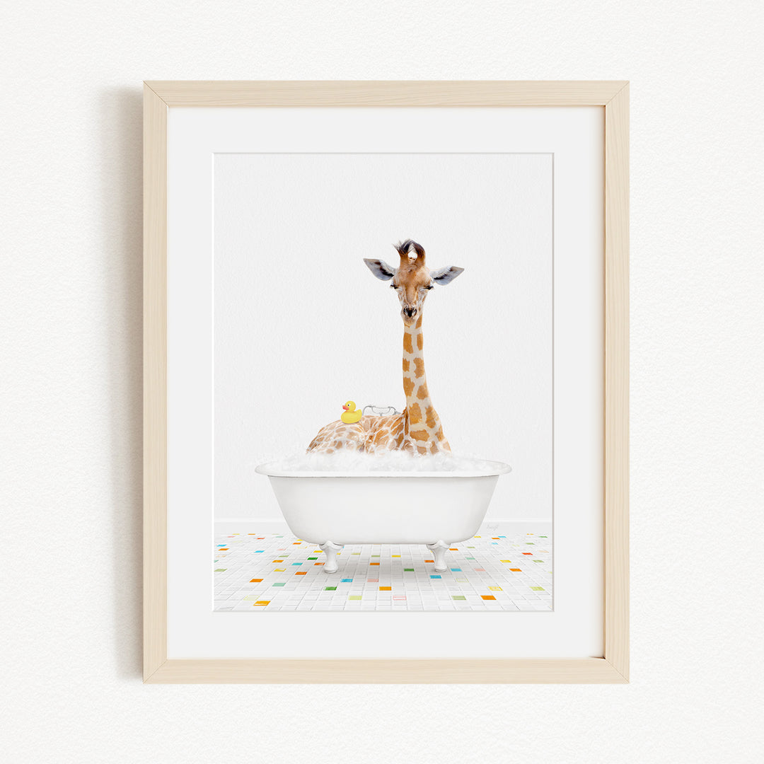A giraffe is sitting in a white bathtub filled with bubbles, surrounded by a colorful tiled floor.