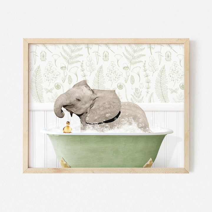 an elephant taking a bath in a green bathtub