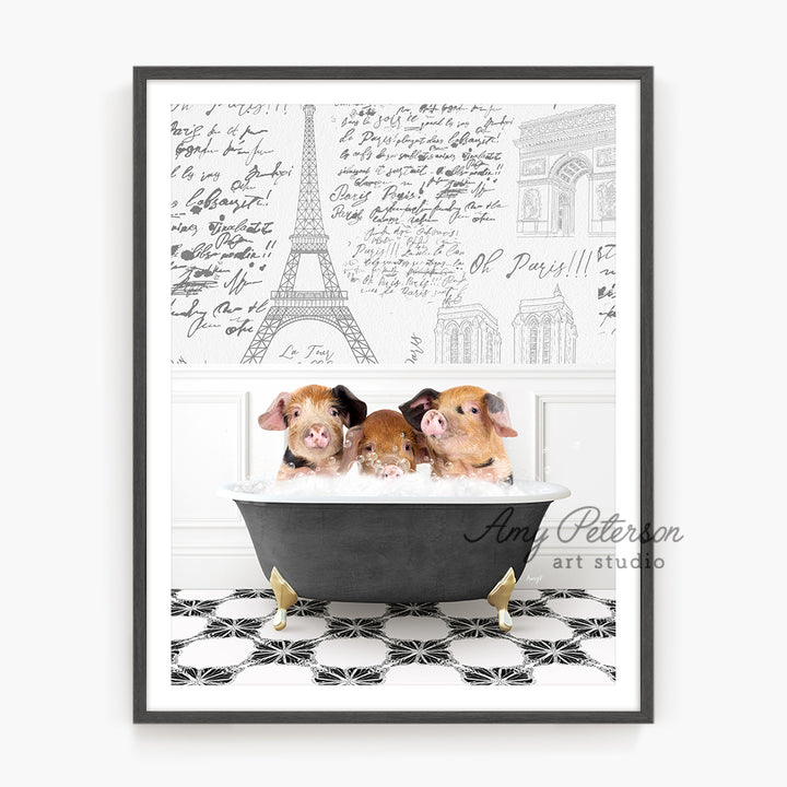 three puppies in a bathtub with the eiffel tower in the background