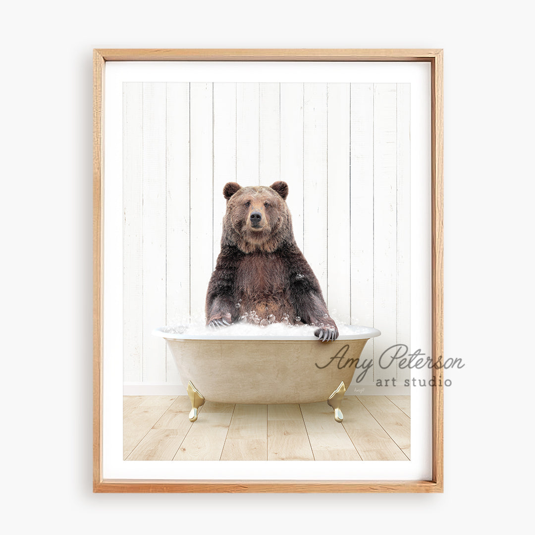 a brown bear sitting in a bath tub