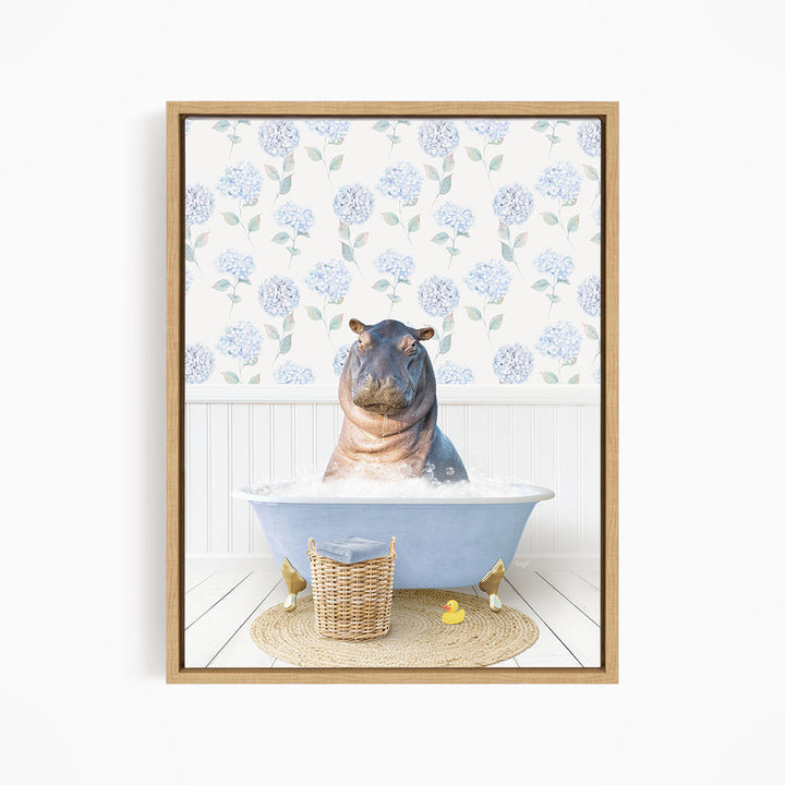 A hippopotamus sitting in a blue bathtub filled with water, surrounded by a wicker basket and yellow rubber ducks.