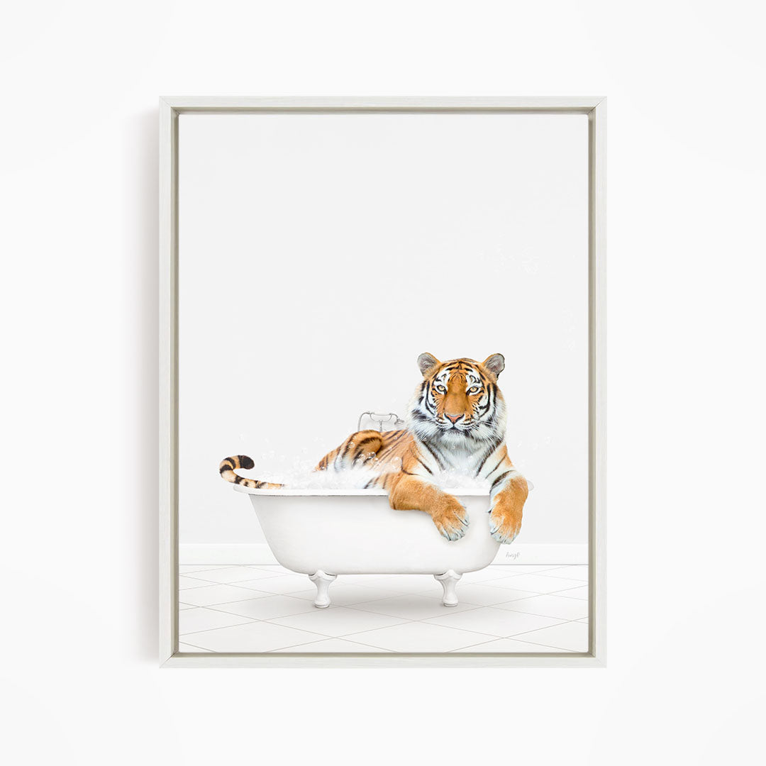 A tiger is sitting in a white bathtub, appearing relaxed and enjoying the bath.