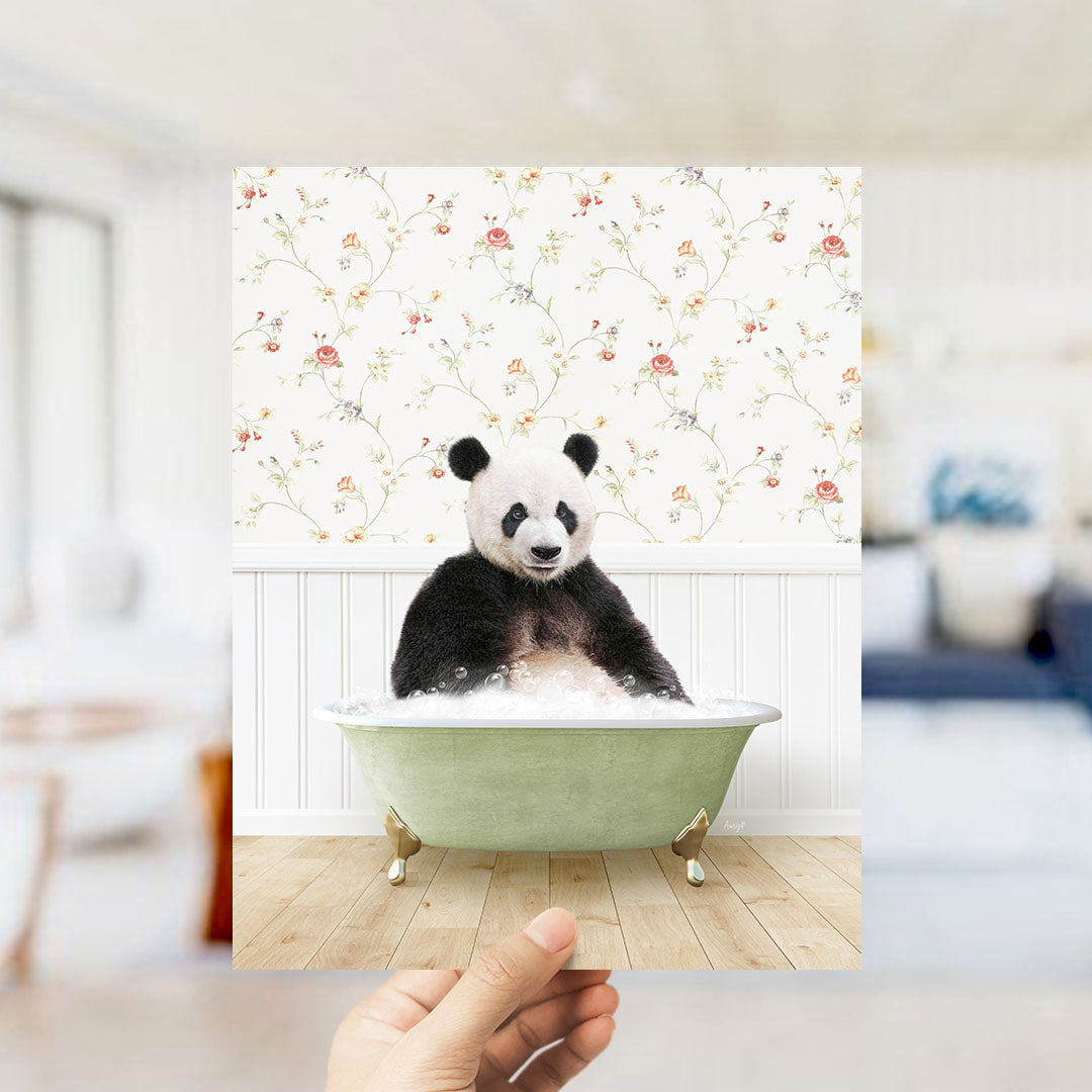 A panda bear sitting in a green bathtub filled with bubbles, surrounded by a floral wallpaper.