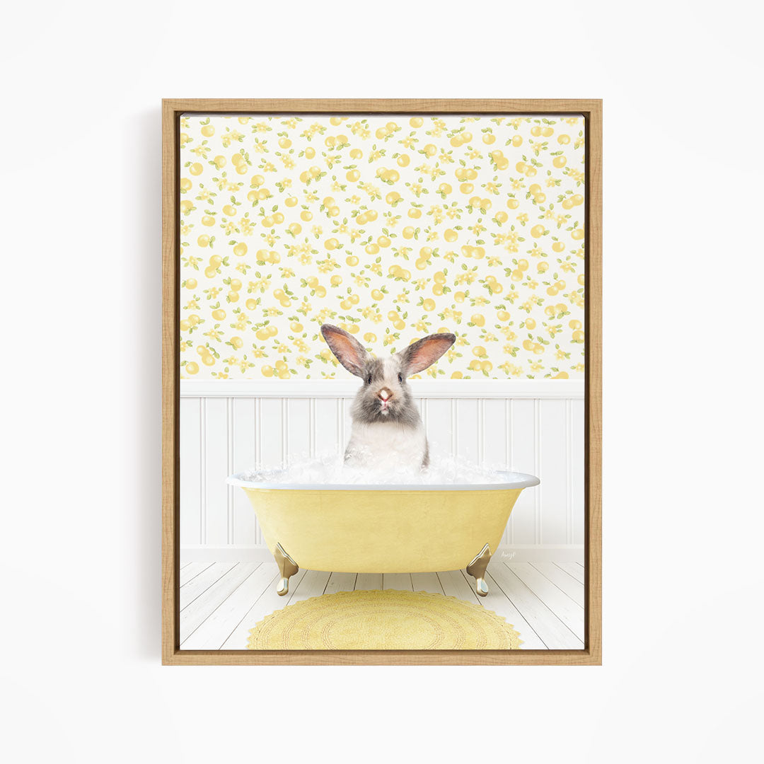 A rabbit sitting in a yellow bathtub filled with water, surrounded by a yellow floral pattern on the wall behind it.