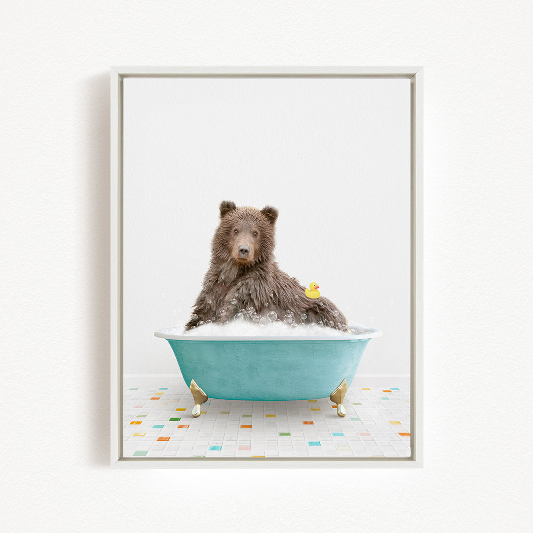 A brown bear sitting in a blue bathtub filled with bubbles, with a rubber duck floating on the water.