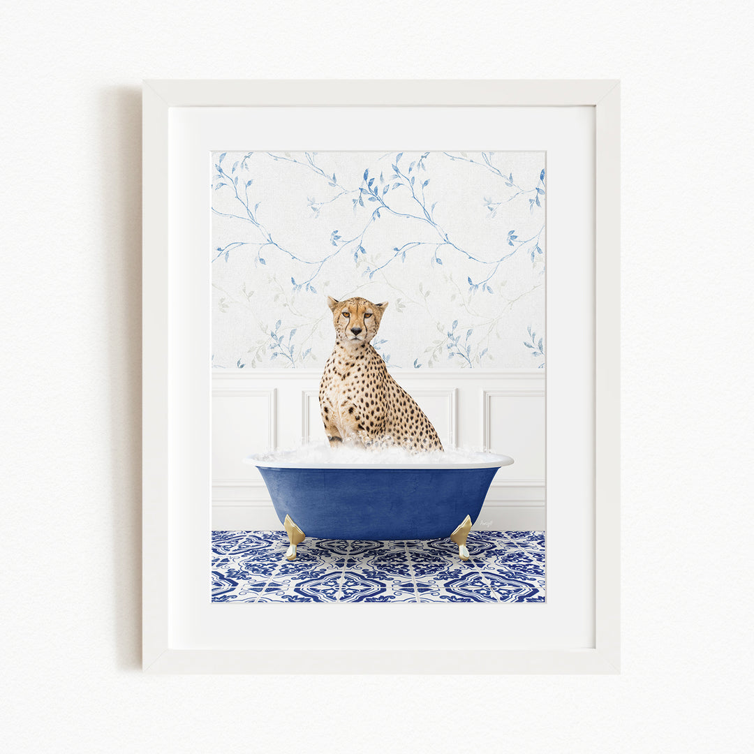 A cheetah sitting in a blue bathtub filled with water, surrounded by a blue and white patterned wall.