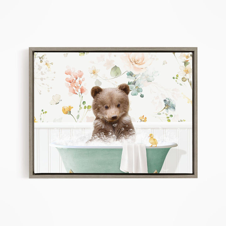 A cute brown bear sitting in a green bathtub filled with bubbles, surrounded by a floral wallpaper.