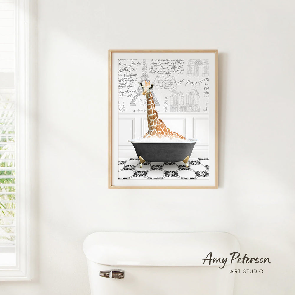 A framed illustration of a giraffe sitting in a bathtub, with architectural drawings visible in the background.