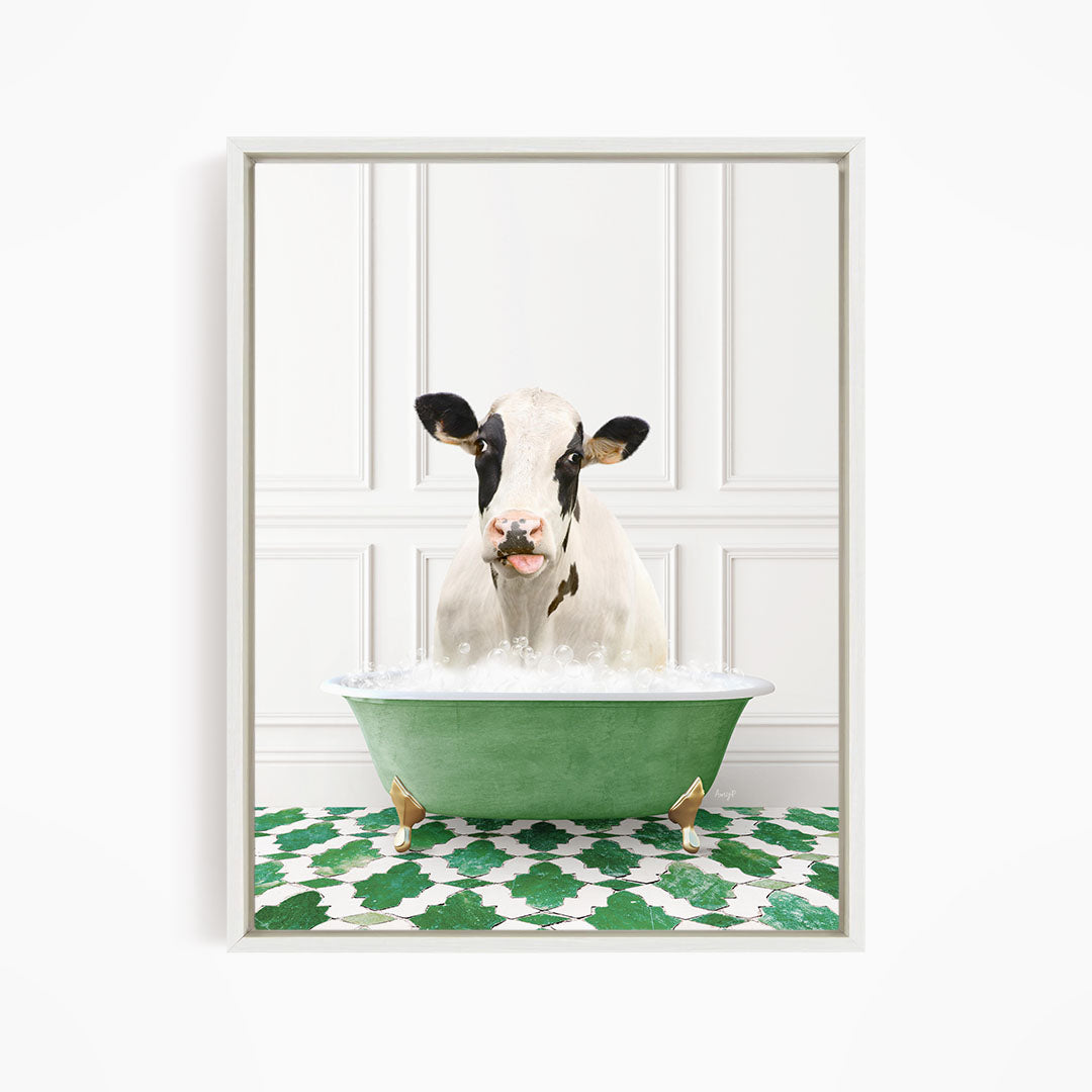 A black and white cow is sitting in a green bathtub filled with water, creating a whimsical and humorous scene.