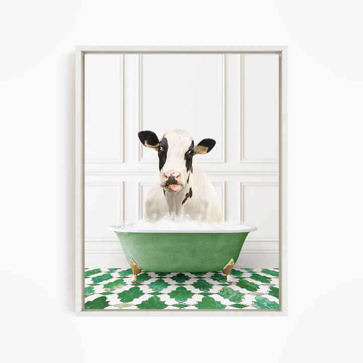 A black and white cow is sitting in a green bathtub filled with water, creating a whimsical and humorous scene.