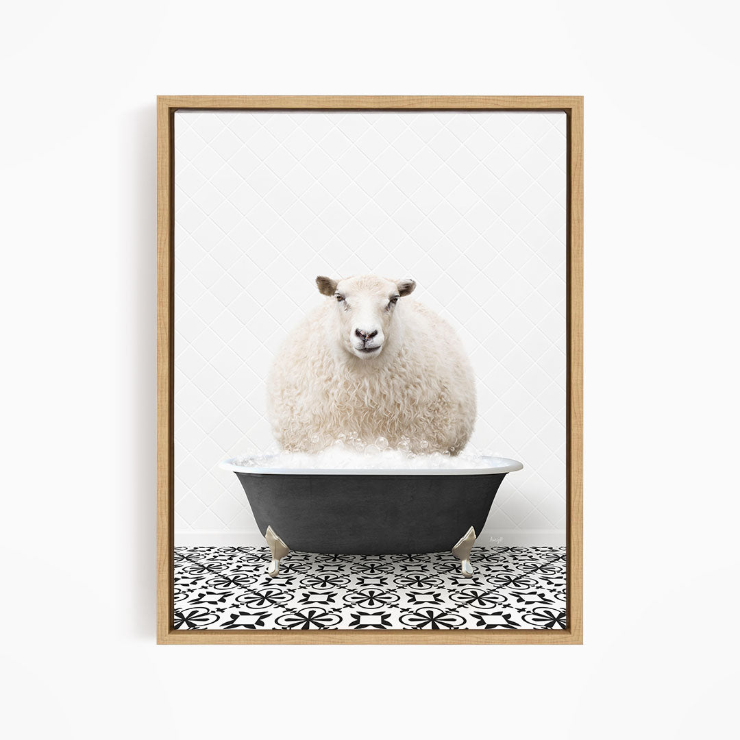 A fluffy white sheep sits in a black bathtub filled with bubbles, creating a whimsical and amusing scene.