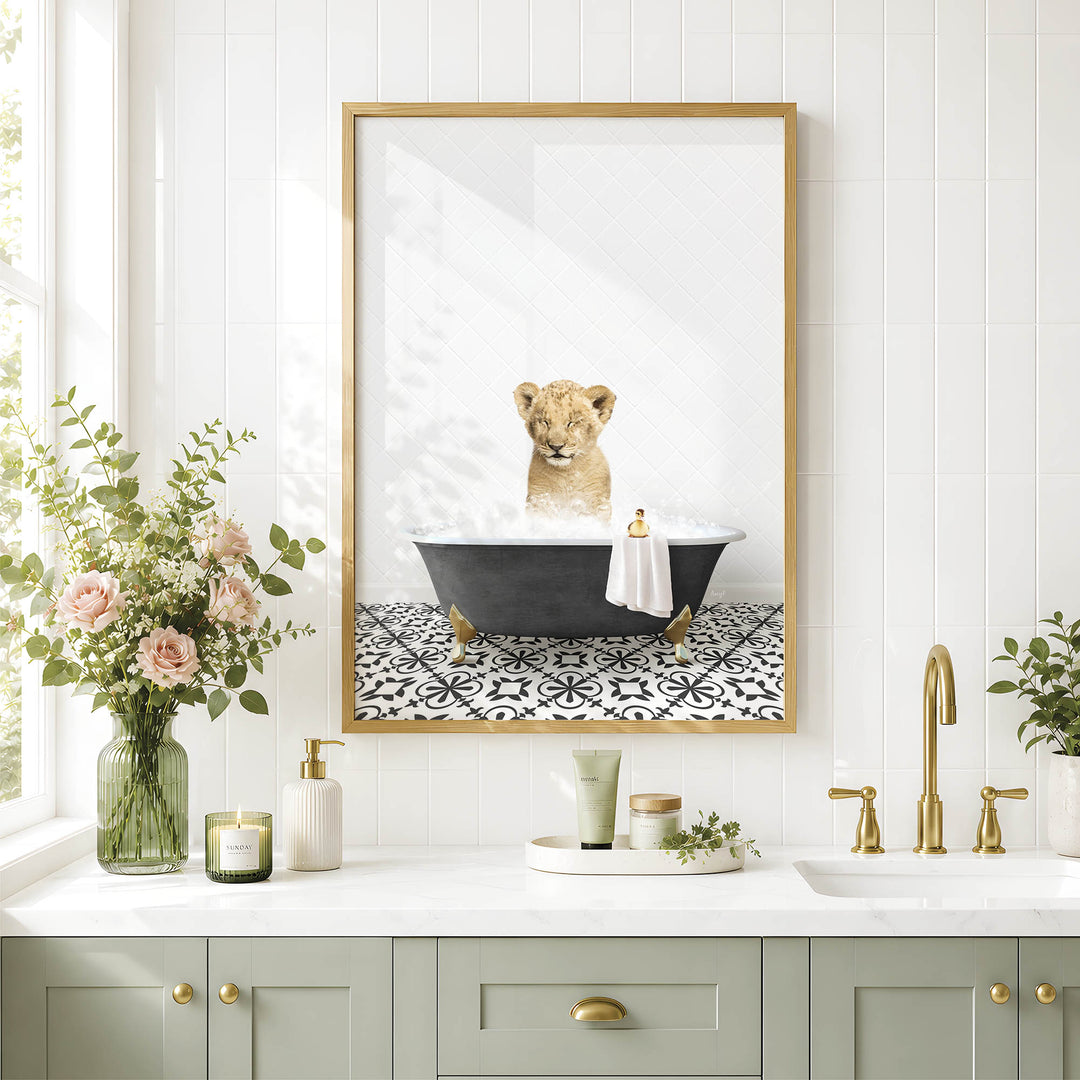 a bathroom scene with a framed picture of a lion taking a bath in a tub, surrounded by various bathroom accessories and decor.