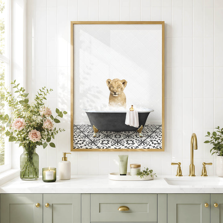 a bathroom scene with a framed picture of a lion taking a bath in a tub, surrounded by various bathroom accessories and decor.
