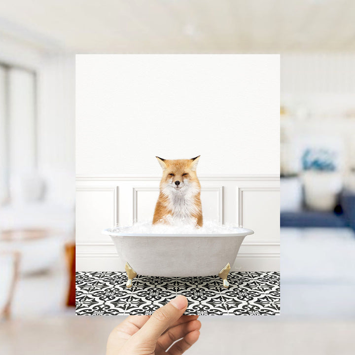 A fox is sitting in a bathtub filled with water, surrounded by a black and white patterned floor.