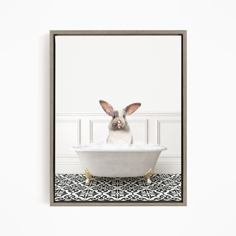 A white rabbit sitting in a white bathtub filled with water, with a black and white patterned floor in the background.