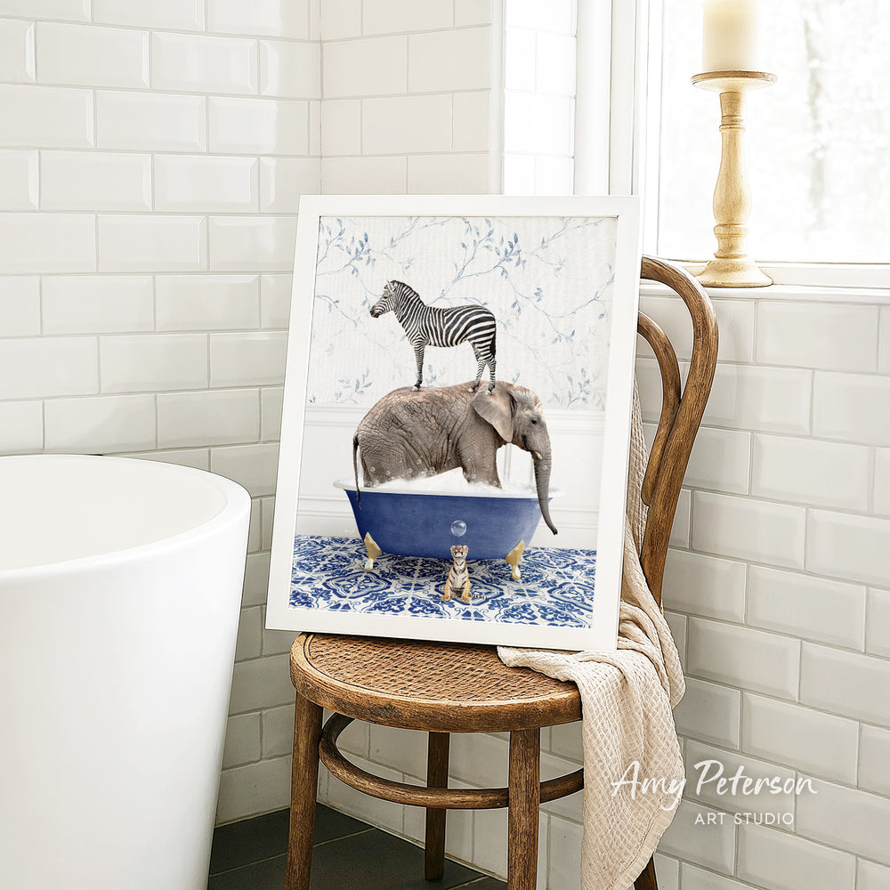 A framed image of a zebra standing on an elephant in a blue bathtub, placed on a wooden chair in a bathroom setting.