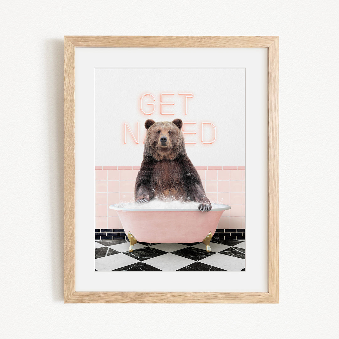 A framed image of a bear sitting in a pink bathtub with the text "GET NICKED" written on the wall behind it.