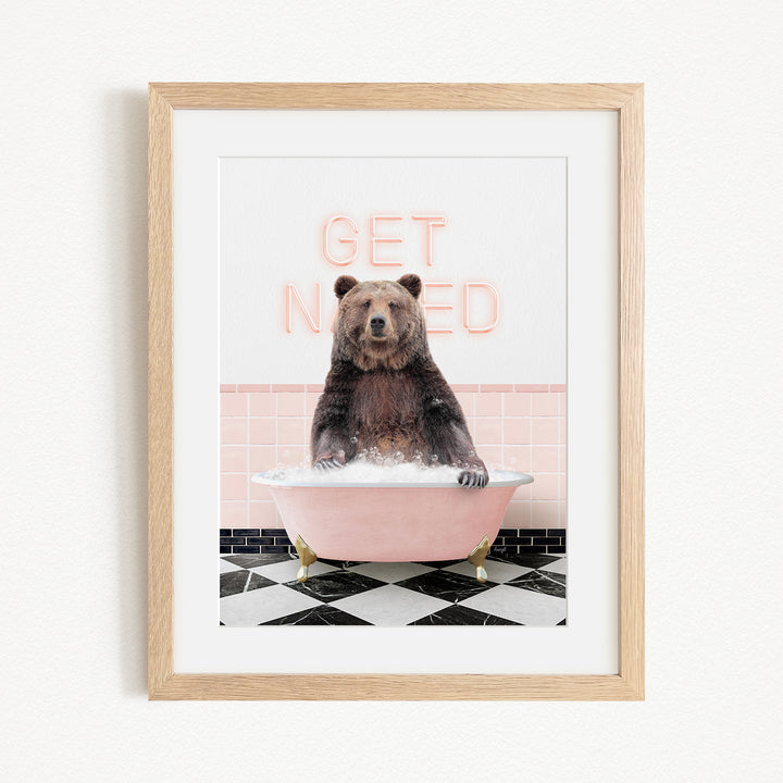 A framed image of a bear sitting in a pink bathtub with the text "GET NICKED" written on the wall behind it.