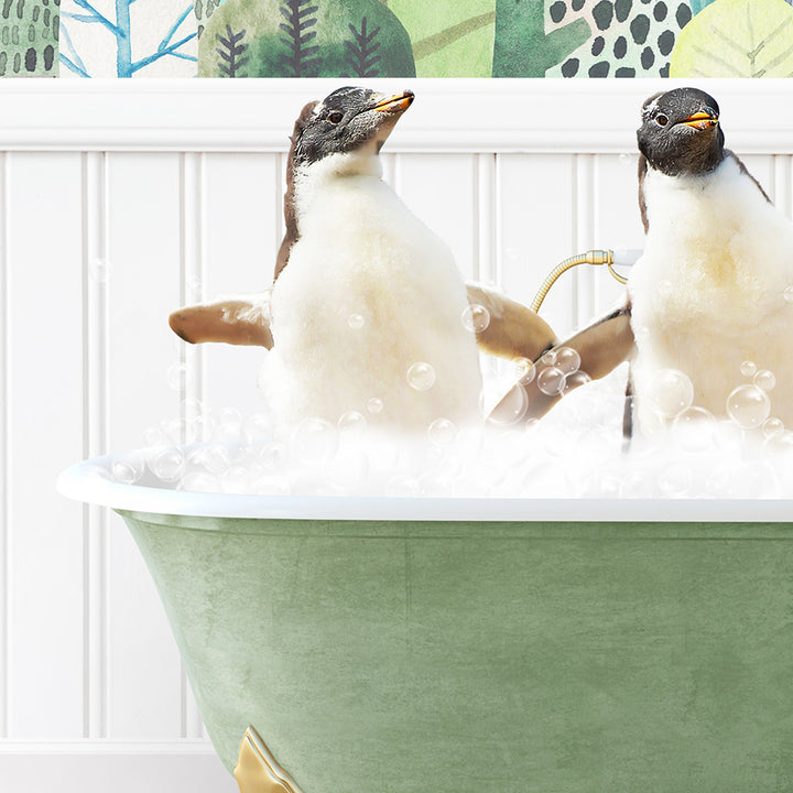 two penguins sitting in a bathtub with bubbles