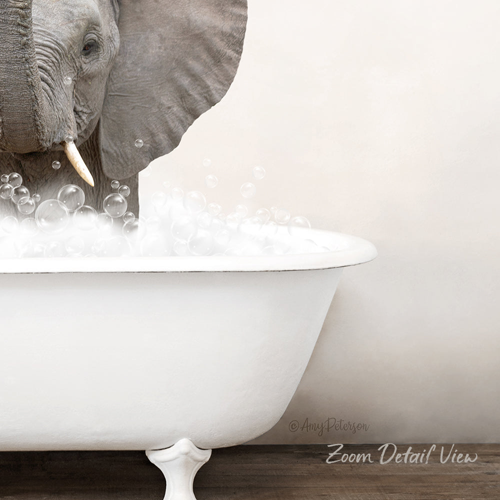 An elephant is standing in a white bathtub filled with bubbles, creating a whimsical and playful scene.