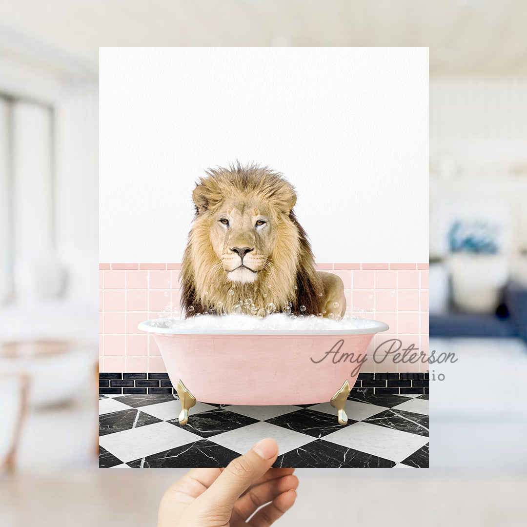 a hand holding a card with a picture of a lion in a bathtub