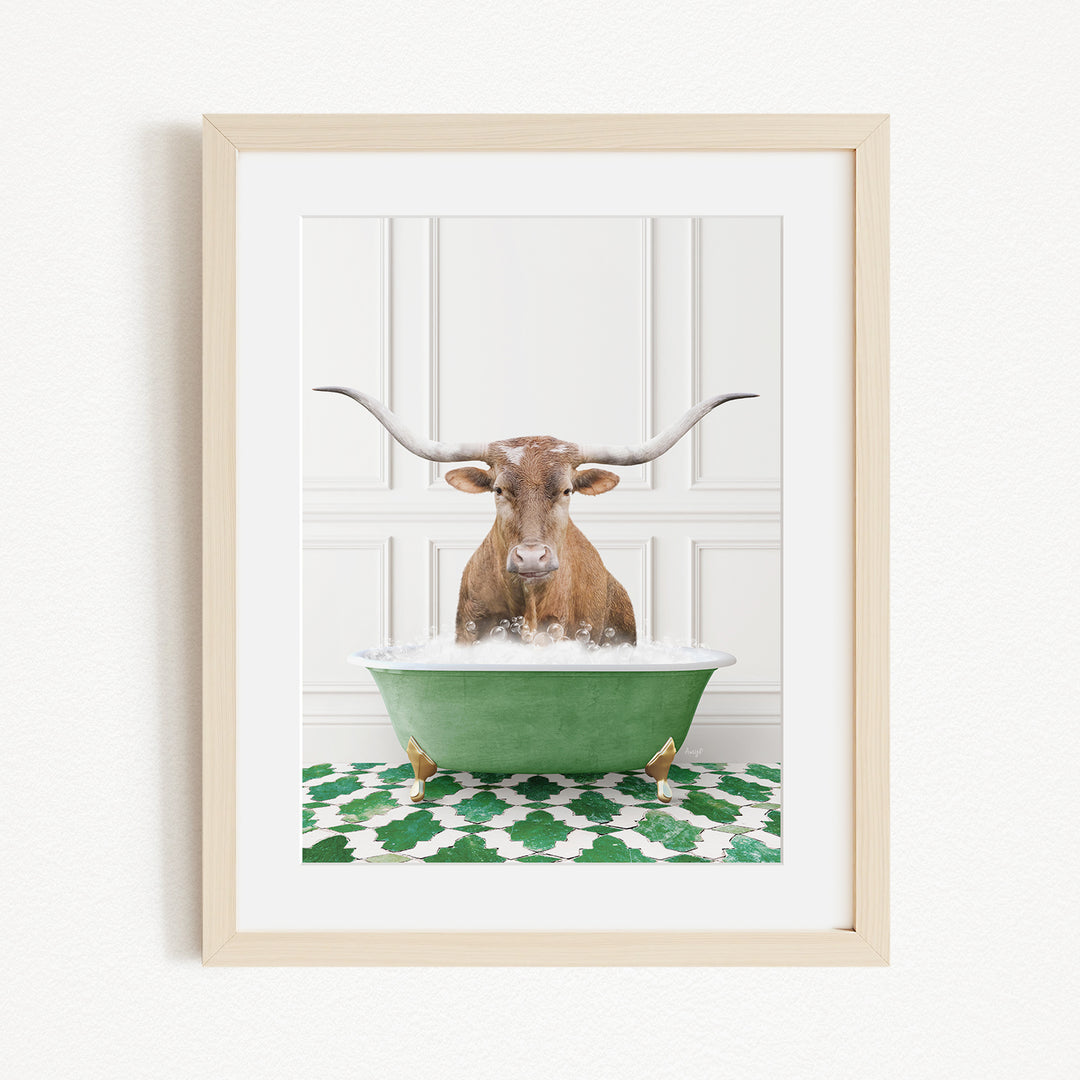 A brown cow with long horns is sitting in a green bathtub filled with water, creating a whimsical and playful scene.