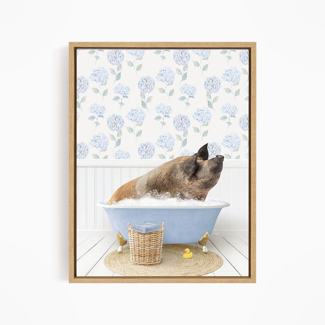 A pig sitting in a blue bathtub filled with water, surrounded by a wicker basket and rubber duckies.