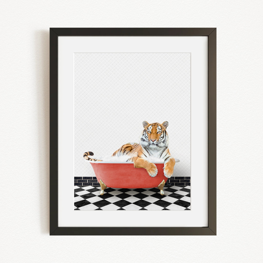 A tiger is sitting in a red bathtub, surrounded by a black and white checkered floor.