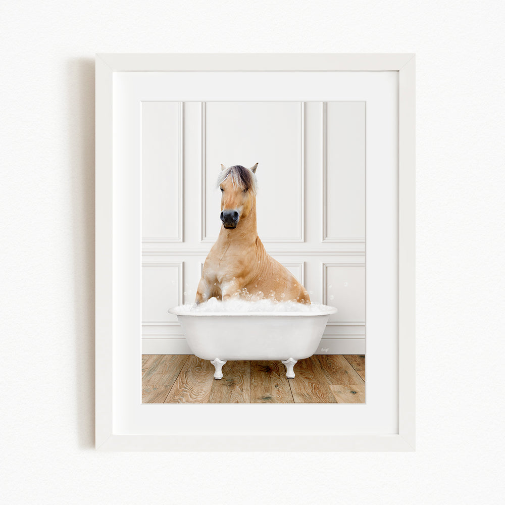 A light brown horse is sitting in a white bathtub filled with water, creating a whimsical and playful scene.