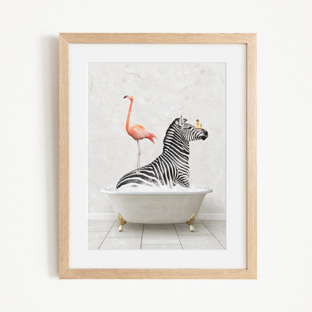 A framed image depicting a zebra sitting in a bathtub, with a flamingo standing on its back and a bird perched on its head.