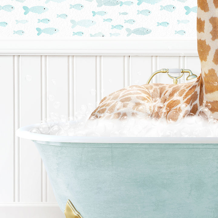 a giraffe laying in a bathtub with bubbles