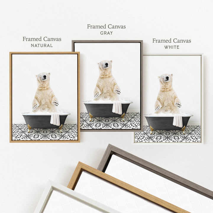 three framed pictures of a polar bear sitting in a bathtub, each with a different colored frame.