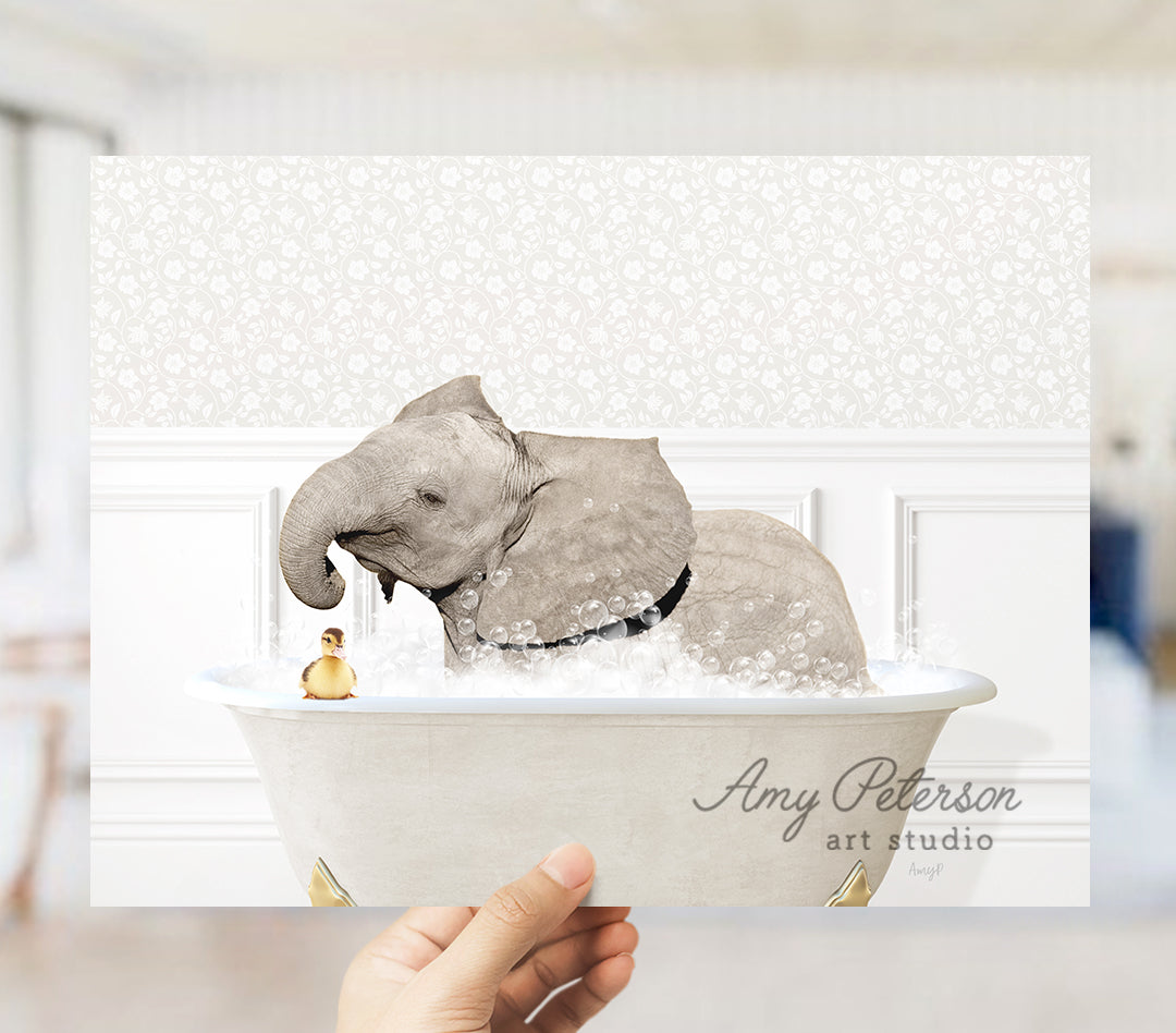 an elephant taking a bath in a bathtub