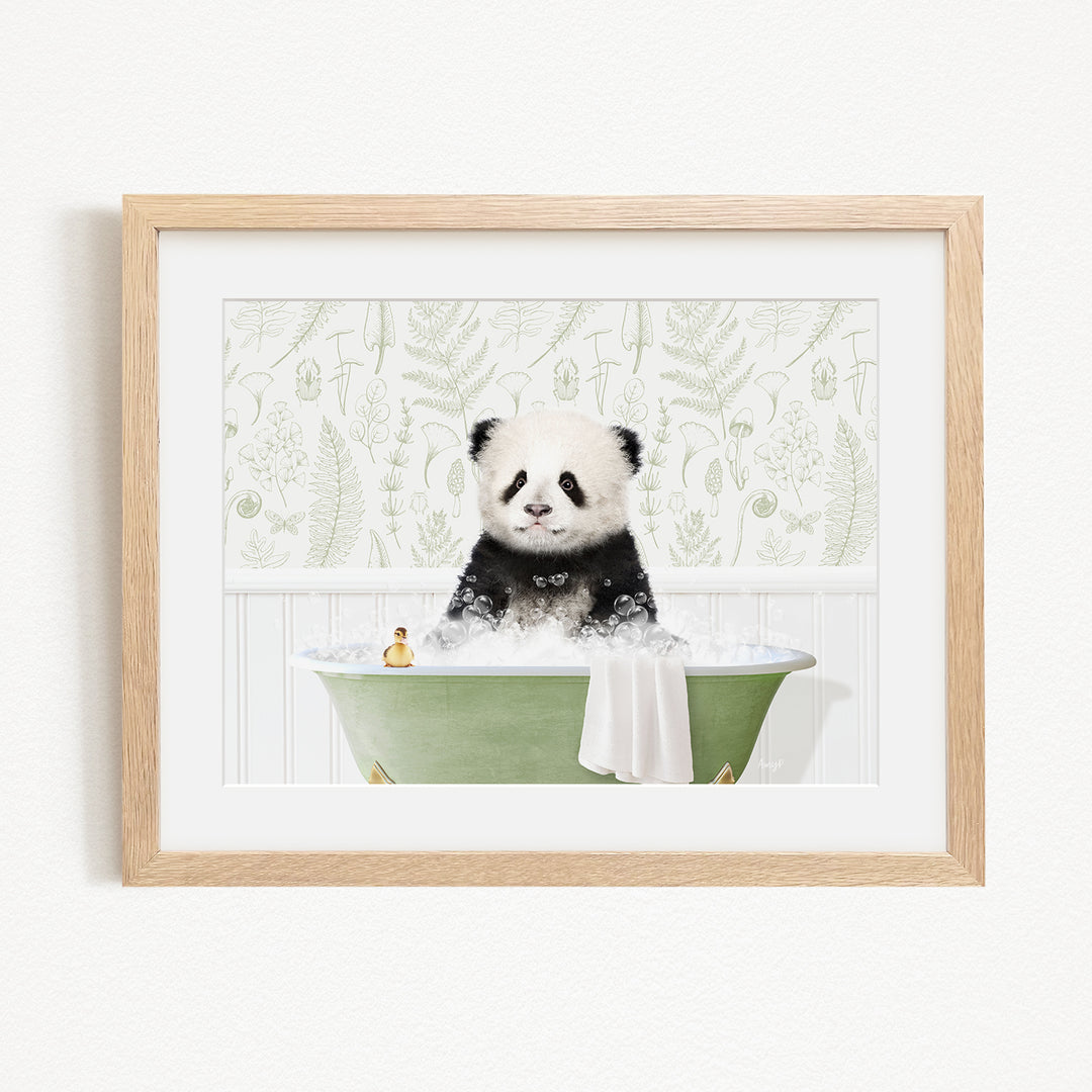 A cute panda bear sitting in a green bathtub, surrounded by a white and green floral pattern.