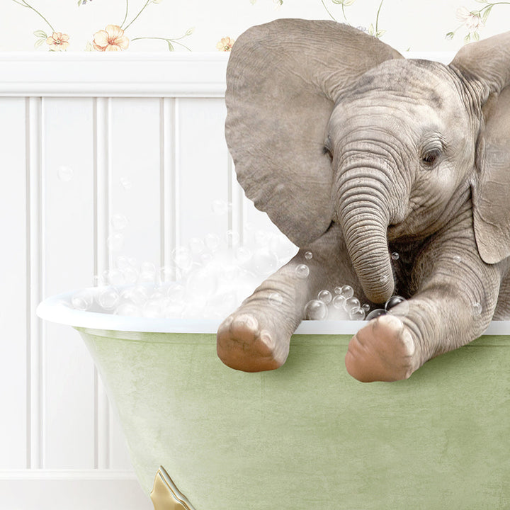 a baby elephant taking a bath in a bathtub