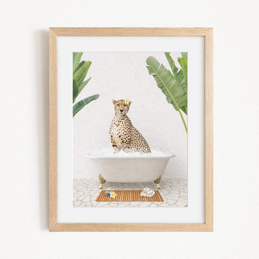 A cheetah sitting in a bathtub filled with water, surrounded by tropical plants.