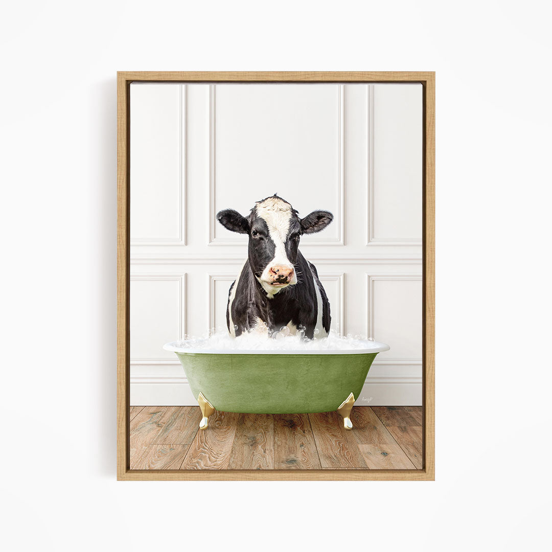 A black and white cow is standing in a green bathtub filled with water, creating a whimsical and humorous scene.