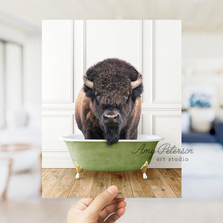 a bison is taking a bath in a green bathtub